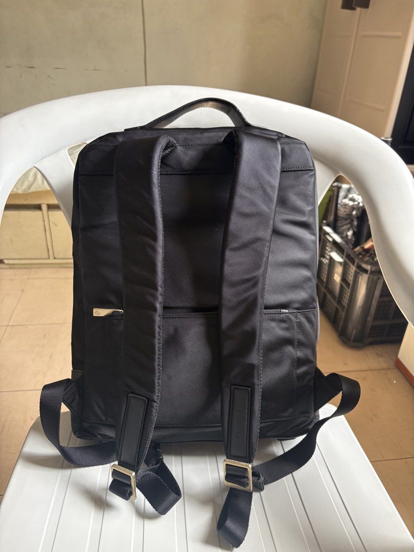 Samsonite black backpack with gold zipper and leather front pocket (Category: Backpacks) located in Quezon City. Submitted by rottiemom (Listing ID 1470991510, Image 2). Description: - Brand: Samsonite - Color: Classic Black - Material: Textured fabric body with smooth leather front pocket and base panels - Hardware: Premium gold-tone zippers and metallic gold brand logo - Comfort: Padded shoulder straps with adjustable metal buckles and a sturdy