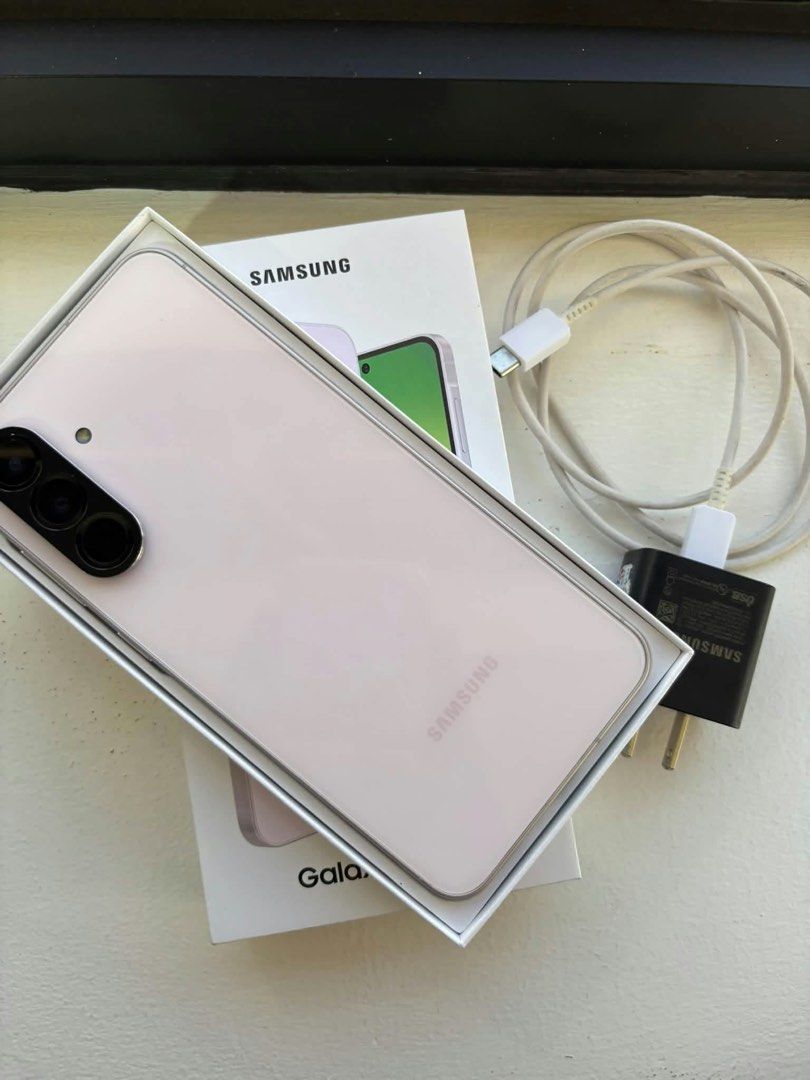 Samsung Galaxy A56 (Category: Samsung) located in Infanta. Submitted by frandez (Listing ID 1471042552, Image 1). Description: - Model: Samsung Galaxy A56 5G - Color: Pink - Condition: Like new / Pwede sa maarte (very smooth, no issues) - Storage & Memory: 256GB storage / 8GB RAM - SIM Type: Dual SIM - Inclusions: Complete with box, charger, and cable.