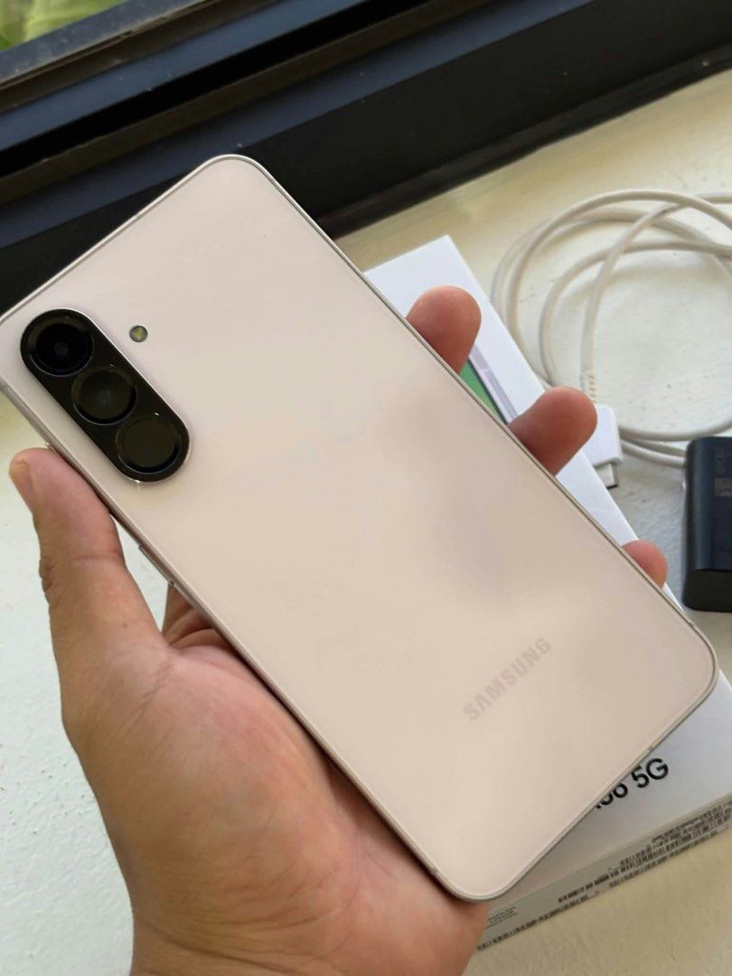 Samsung Galaxy A56 (Category: Samsung) located in Infanta. Submitted by frandez (Listing ID 1471042552, Image 3). Description: - Model: Samsung Galaxy A56 5G - Color: Pink - Condition: Like new / Pwede sa maarte (very smooth, no issues) - Storage & Memory: 256GB storage / 8GB RAM - SIM Type: Dual SIM - Inclusions: Complete with box, charger, and cable.