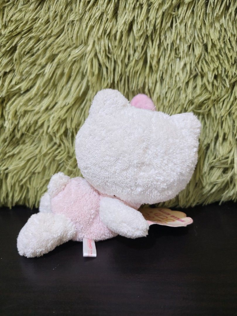 Sanrio Hello Kitty Nadenade Doll 2005 Plush (Category: Plushies & Soft Toys) located in La Trinidad. Submitted by charlsensei (Listing ID 1471061999, Image 2). Description: - Authentic Sanrio Kitty plush doll from 2005 - Features fluffy white fur with a pink outfit and matching bow - Comes with original Japanese hang tag attached - Brand new and packed inside its original clear plastic bag - Compact size, perfect for Sanrio collectors and fans.