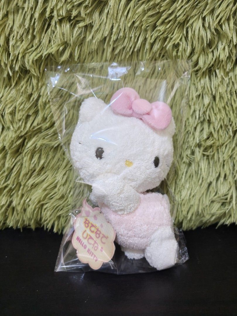 Sanrio Hello Kitty Nadenade Doll 2005 Plush (Category: Plushies & Soft Toys) located in La Trinidad. Submitted by charlsensei (Listing ID 1471061999, Image 3). Description: - Authentic Sanrio Kitty plush doll from 2005 - Features fluffy white fur with a pink outfit and matching bow - Comes with original Japanese hang tag attached - Brand new and packed inside its original clear plastic bag - Compact size, perfect for Sanrio collectors and fans.