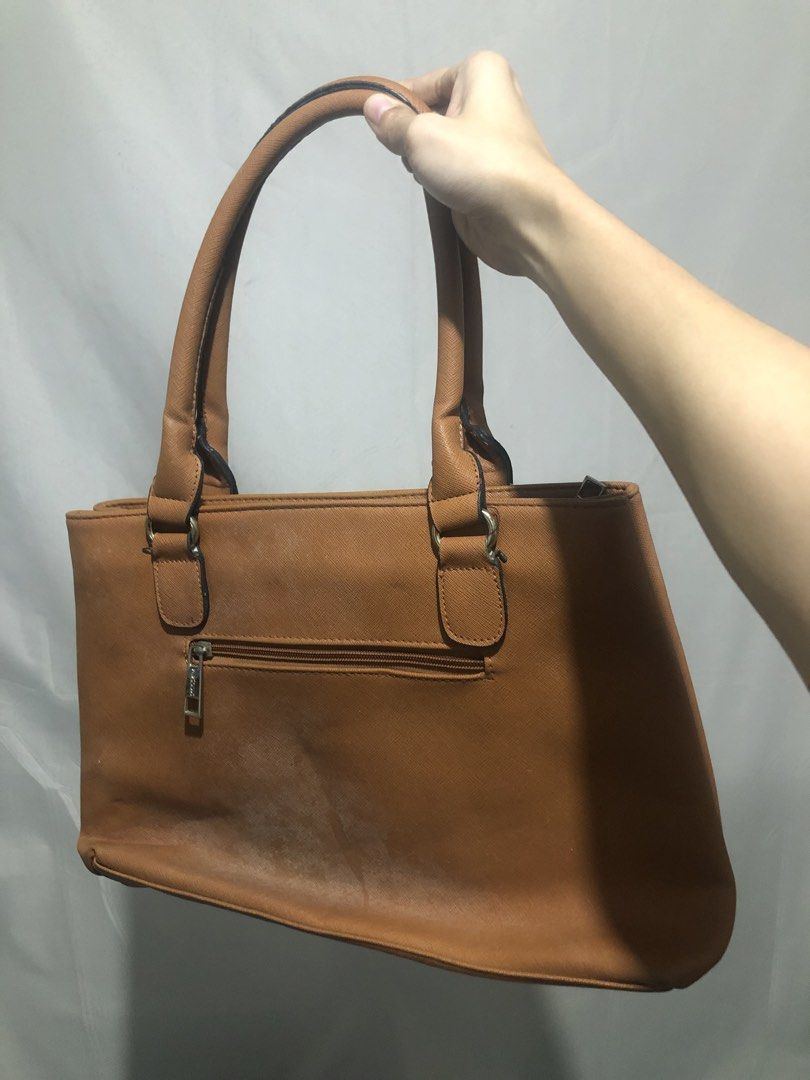 Secosana Tan Handbag and Blue Shoulder Bag Bundle (Category: Shoulder Bags) located in General Trias. Submitted by dmcwl (Listing ID 1471050395, Image 2). Description: PRELOVED BAGS FOR SALE! BUNDLED NA PO ITO FOR THE PRICE. - Bundle includes: Secosana tan structured handbag (with metal studs, logo plate, and zippered back pocket) and a blue bag (with tan straps and wooden tassel charm). - Condition: Clean interiors, minimal signs of wear on the 