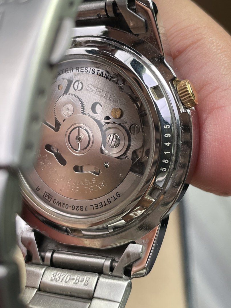 Seiko 5 Automatic Watch 7S26-02W0 (Category: Men's Watches) located in Calapan. Submitted by lucasthrifts (Listing ID 1471018944, Image 2). Description: - Model: Seiko 5 Automatic (Reference 7S26-02W0) - Dial: Classic black with elegant gold-tone hands and markers - Features: Convenient day-date window at 3 o'clock - Movement: Reliable 21-jewels automatic movement with exhibition case back - Inclusions: Stainless steel bracelet with extra links a