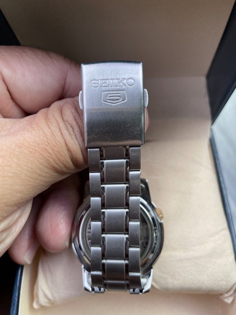 Seiko 5 Automatic Watch 7S26-02W0 (Category: Men's Watches) located in Calapan. Submitted by lucasthrifts (Listing ID 1471018944, Image 3). Description: - Model: Seiko 5 Automatic (Reference 7S26-02W0) - Dial: Classic black with elegant gold-tone hands and markers - Features: Convenient day-date window at 3 o'clock - Movement: Reliable 21-jewels automatic movement with exhibition case back - Inclusions: Stainless steel bracelet with extra links a