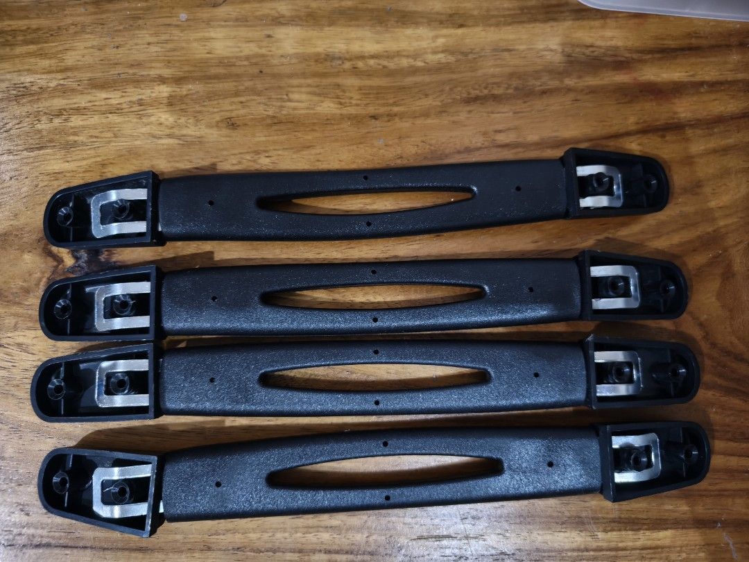 Set of 4 Replacement Black Suitcase Handles (Category: Luggage) located in Bacoor. Submitted by declutterwithme05 (Listing ID 1471055423, Image 1). Description: - Set of 4 black replacement handles for luggage and suitcases - Made of durable solid plastic with reinforced metal mounting brackets at both ends - Ergonomic center cutout grip design for comfortable carrying - Standard mounting hole configuration for easy installation - Clean condition