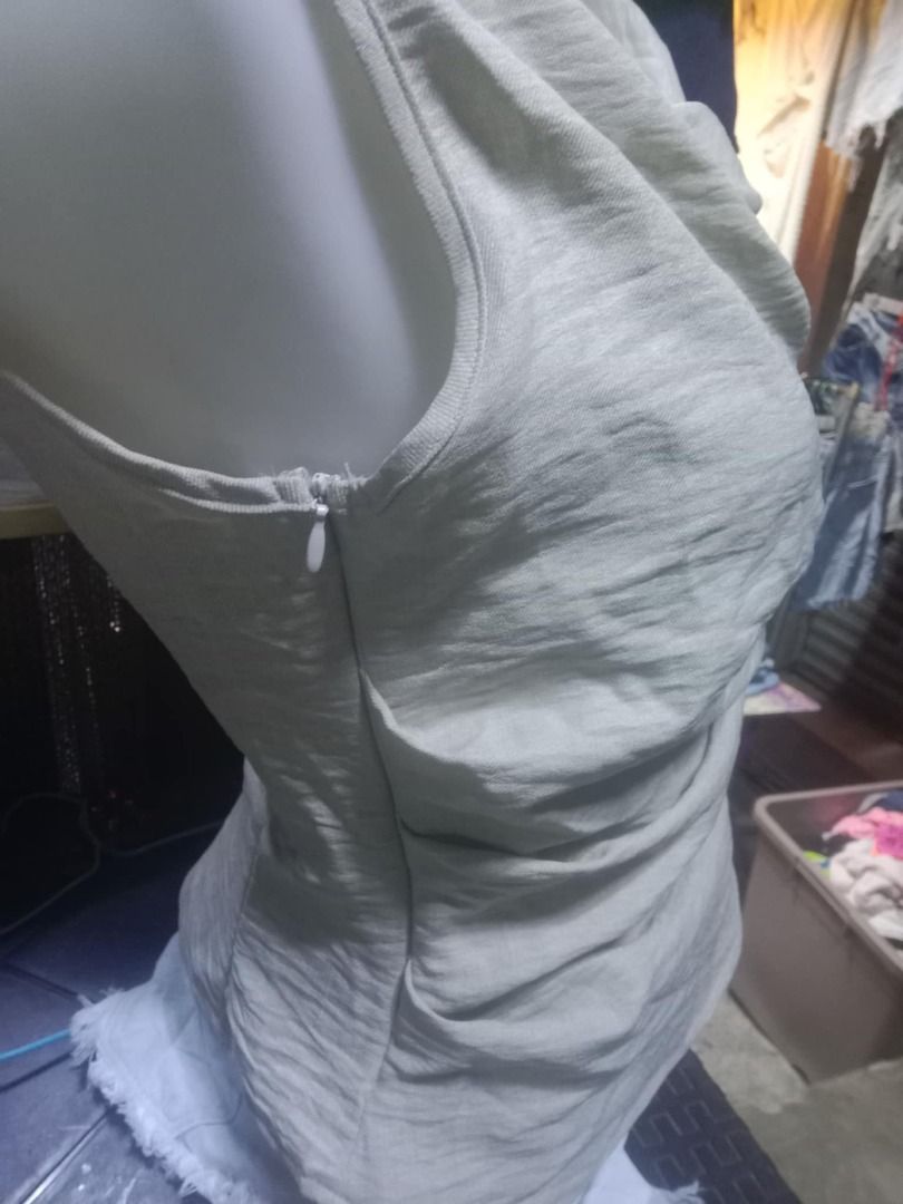 SHEIN Beige Sleeveless Draped Top XS (Category: Sleeveless) located in Quezon City. Submitted by honeyonline.ph (Listing ID 1471041613, Image 3). Description: - Brand: Shein - Size: XS (tag attached) - Color: Neutral beige - Material: 100% textured polyester - Design: Asymmetrical draped neckline with stylish wrapped front and back - Closure: Side zipper - Fit: Slim fit - Care: Hand wash recommended.