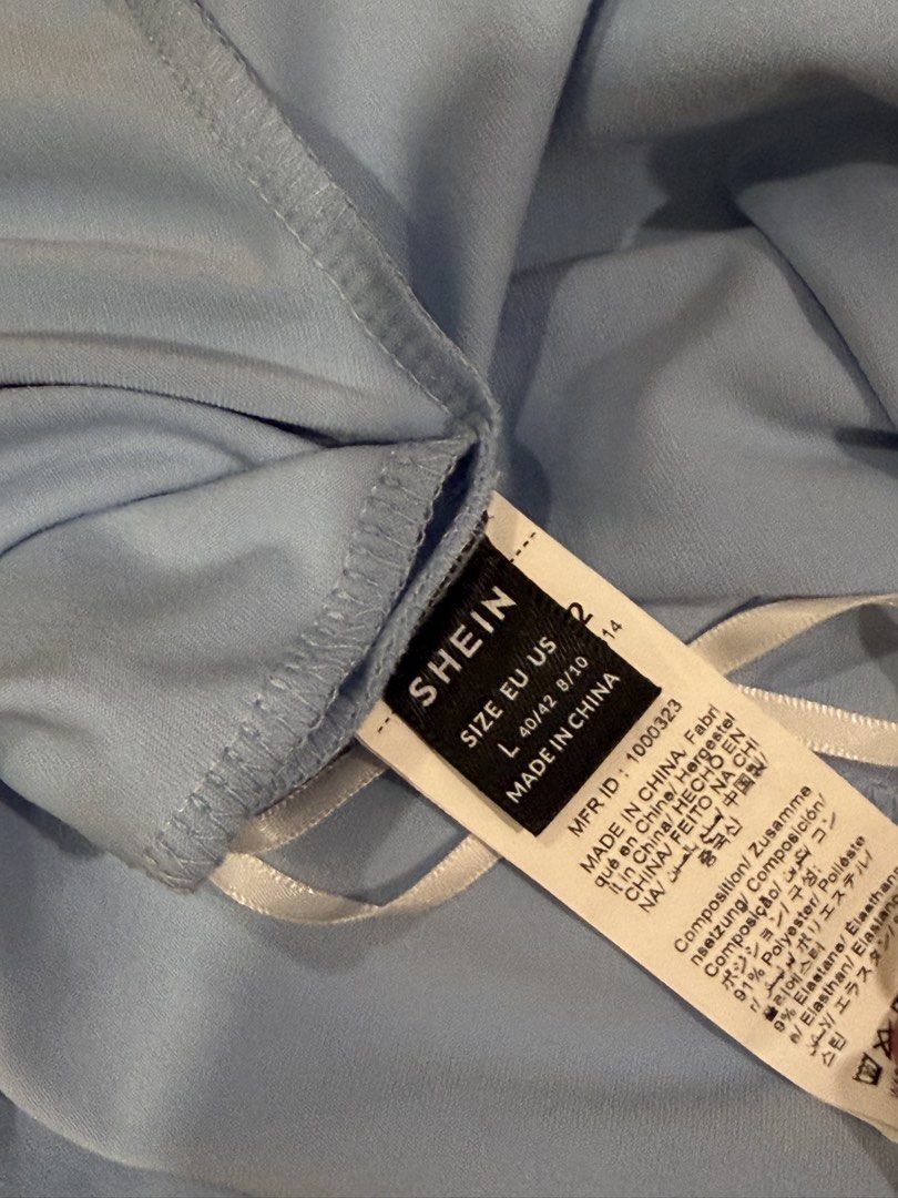 SHEIN Blue One-Shoulder Asymmetrical Top (Category: Sleeveless) located in Muntinlupa City. Submitted by alexisofia (Listing ID 1471084860, Image 3). Description: brand new, never worn/ excellent condition Size: L (EU 40 / US 12 / UK 14) Brand: SHEIN Color: Blue.