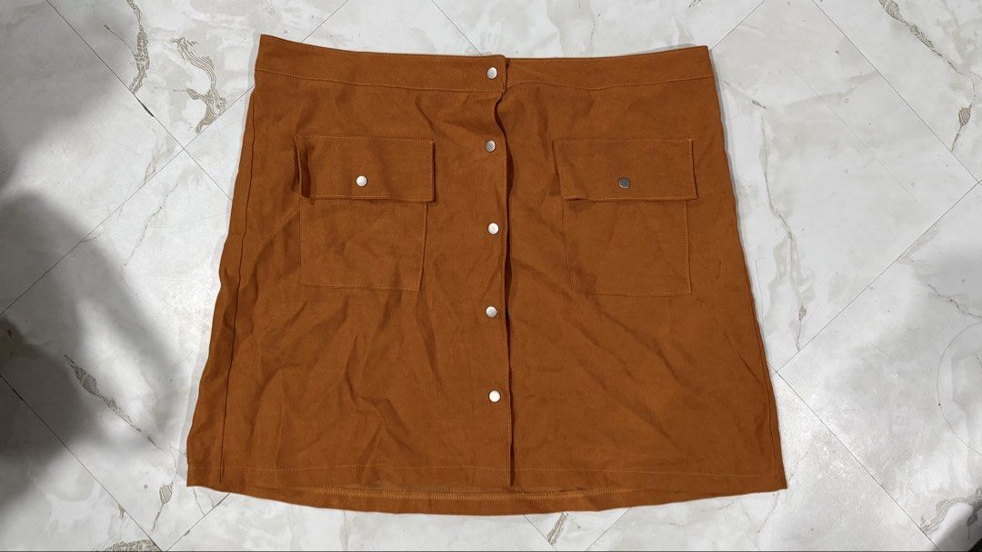 Shein Brown Buttondown Skirt (Category: Skirts) located in Quezon City. Submitted by dinesaur (Listing ID 1471076755, Image 1). Description: 36 waist laid flat.