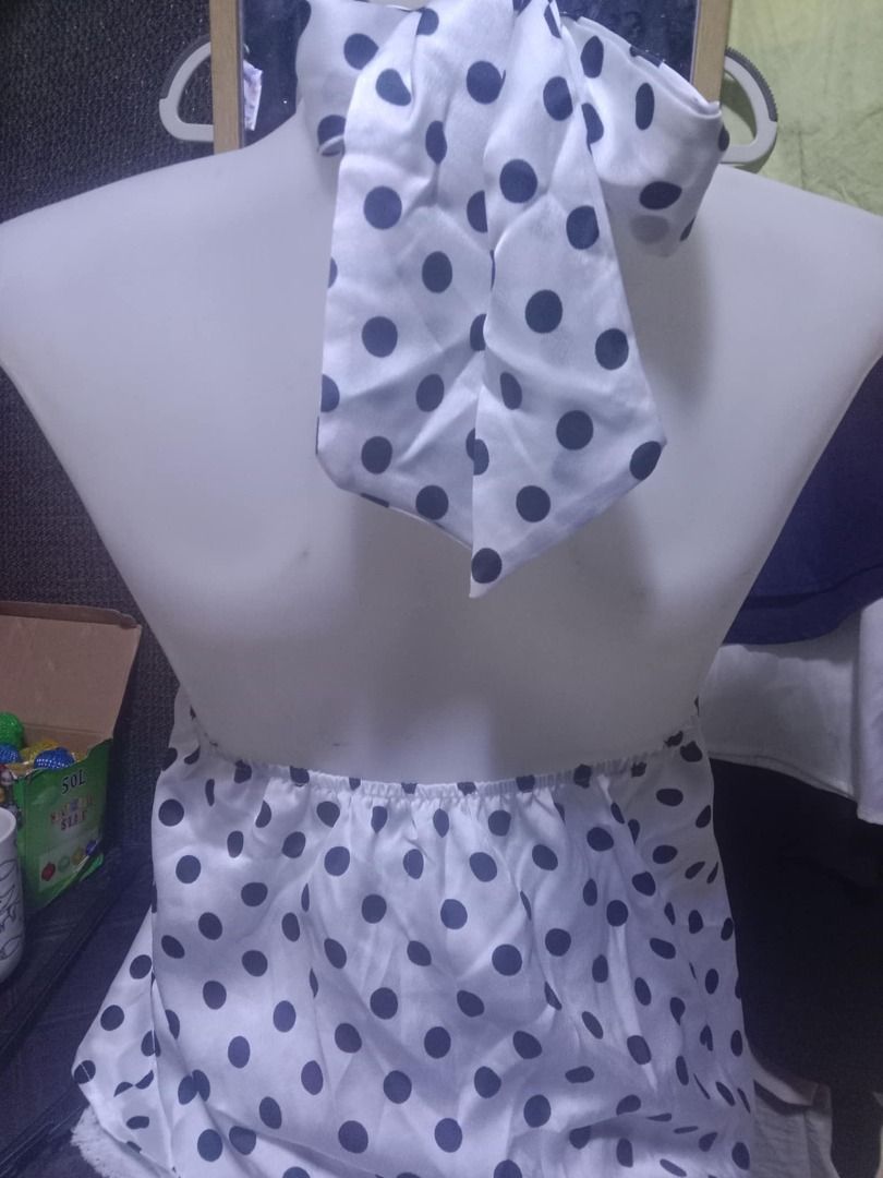 SHEIN Polka Dot Halter Top XS (Category: Sleeveless) located in Quezon City. Submitted by honeyonline.ph (Listing ID 1471033216, Image 3). Description: - Brand: SHEIN - Size: XS - Condition: Brand new with tags (never worn) - Design: White with dark blue polka dots, twist halter neck, and tie-back closure - Material: 100% polyester (lightweight, perfect for summer).