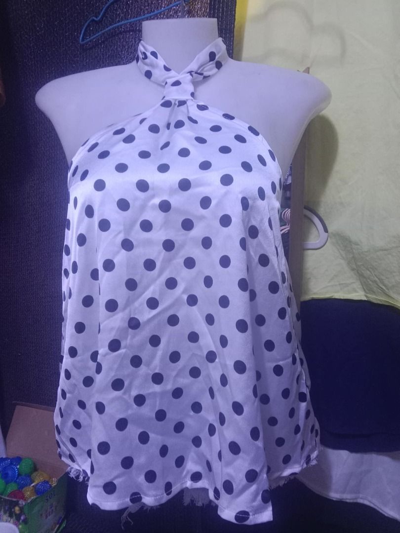 SHEIN Polka Dot Halter Top XS (Category: Sleeveless) located in Quezon City. Submitted by honeyonline.ph (Listing ID 1471033216, Image 1). Description: - Brand: SHEIN - Size: XS - Condition: Brand new with tags (never worn) - Design: White with dark blue polka dots, twist halter neck, and tie-back closure - Material: 100% polyester (lightweight, perfect for summer).
