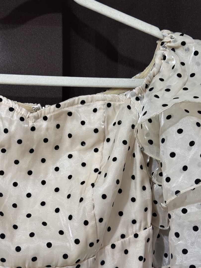 SHEIN Polka Dress (Category: Dresses) located in Quezon City. Submitted by quickmoon_3a73ae (Listing ID 1471019018, Image 3). Description: - Brand: Shein - Style: Cream midi dress with black polka dots - Size: S (Fits US 4 / EU 36) - Material: 100% polyester with a shiny finish - Features: Off-shoulder neckline, layered ruffled short sleeves, and back zipper closure - Occasion: Great for dates and casual outings - Condition: Excellent.