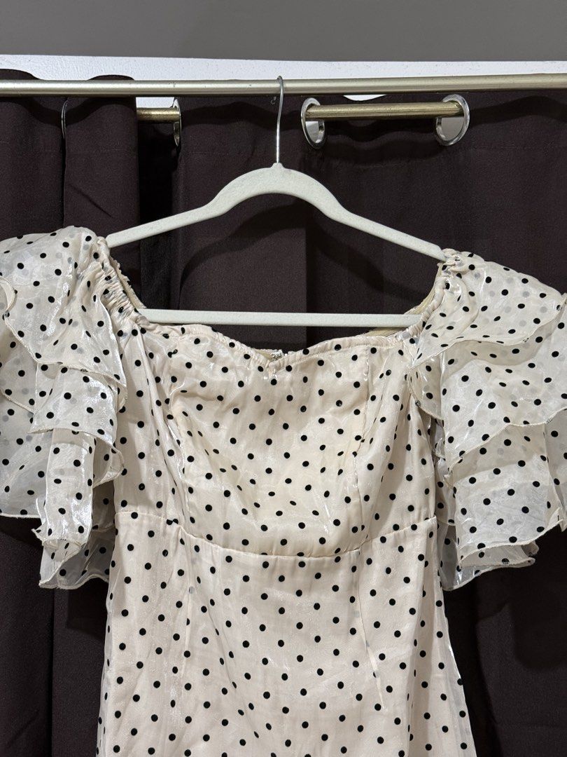 SHEIN Polka Dress (Category: Dresses) located in Quezon City. Submitted by quickmoon_3a73ae (Listing ID 1471019018, Image 2). Description: - Brand: Shein - Style: Cream midi dress with black polka dots - Size: S (Fits US 4 / EU 36) - Material: 100% polyester with a shiny finish - Features: Off-shoulder neckline, layered ruffled short sleeves, and back zipper closure - Occasion: Great for dates and casual outings - Condition: Excellent.