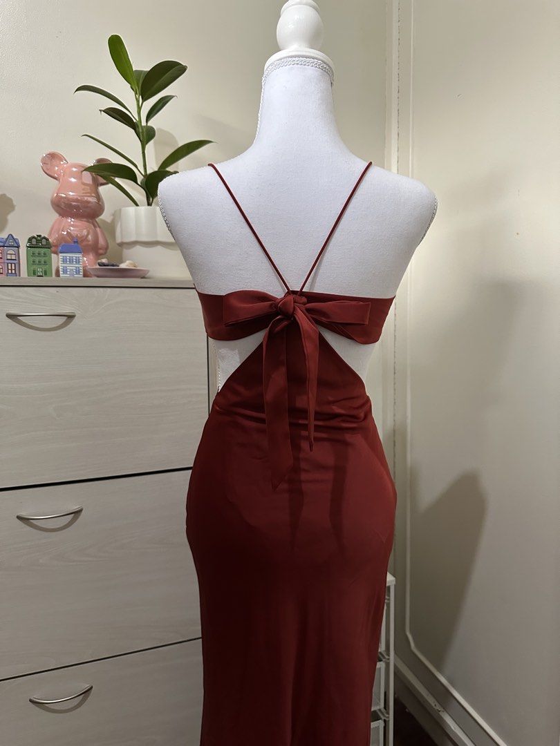 Shein Red Cutout Maxi Dress with Back Bow (Category: Dresses) located in Antipolo. Submitted by wxyz9876 (Listing ID 1471057090, Image 3). Description: - Brand/Style: Shein satin maxi dress - Color: Gorgeous maroon red - Size: XS to S - Material: Smooth fabric with a lovely drape - Condition: Worn twice, stored properly Perfect for xmas parties!! Dm me for when worn!.