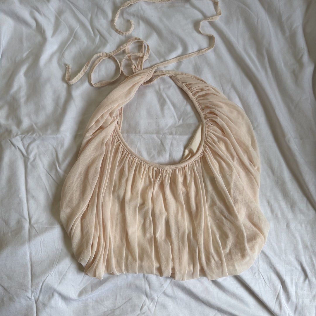 Shein Ruched Halter Top Beige (Category: Sleeveless) located in Cavite. Submitted by kydeclutter (Listing ID 1470983089, Image 1). Description: - Sheer mesh fabric with tons of gathering and ruching down the front. - Tie closure at the neck and back. - Super cute flowy drape. - Just a quick note: Color is more beige in real life than ww pics by model - Brand new, never worn out - RFS: Not my style.