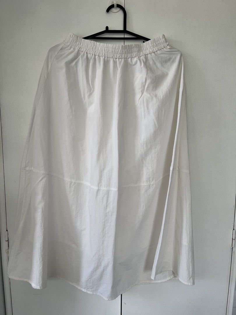SHEIN White Midi Skirt (Category: Skirts) located in Cebu City. Submitted by stylebyregi (Listing ID 1470970789, Image 1). Description: No issues, can pass as like new Size will fit til large Very flattering fit Length calf area if youre 5’2.