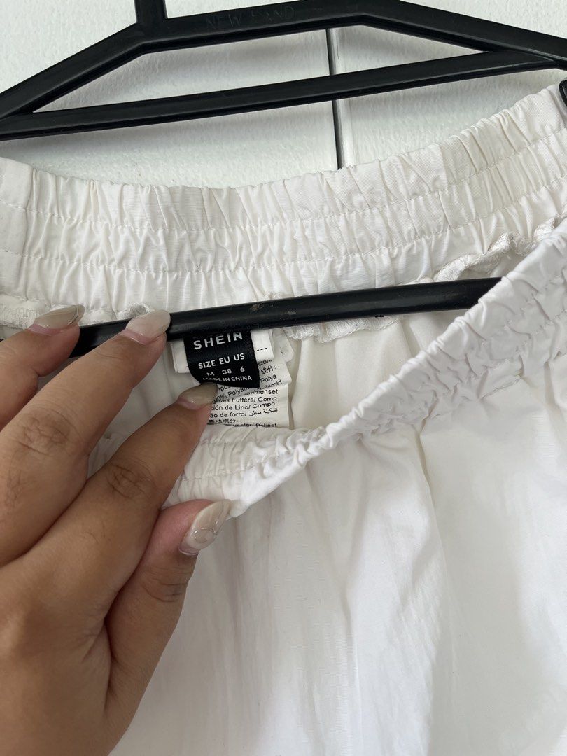 SHEIN White Midi Skirt (Category: Skirts) located in Cebu City. Submitted by stylebyregi (Listing ID 1470970789, Image 3). Description: No issues, can pass as like new Size will fit til large Very flattering fit Length calf area if youre 5’2.