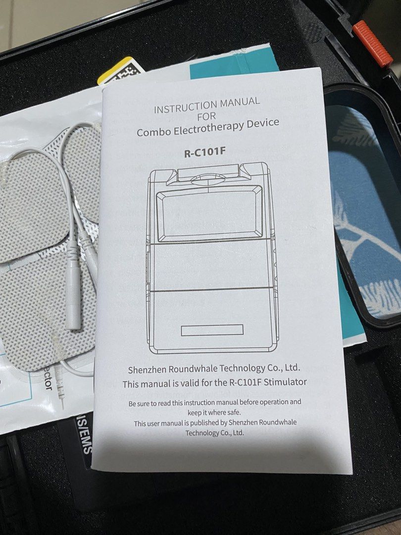 Shenzhen Roundwhale Combo Electrotherapy Device R-C101F TENS/EMS (Category: Medical Supplies & Tools) located in Cebu City. Submitted by greatdeal.e6c8cf (Listing ID 1471009016, Image 2). Description: Shenzhen Roundwhale combo electrotherapy device, model R-C101F. TENS and EMS functions for muscle stimulation and pain relief. Includes: main unit, lead wires, reusable self-adhesive electrode pads, instruction manual, and hard carrying case with ha