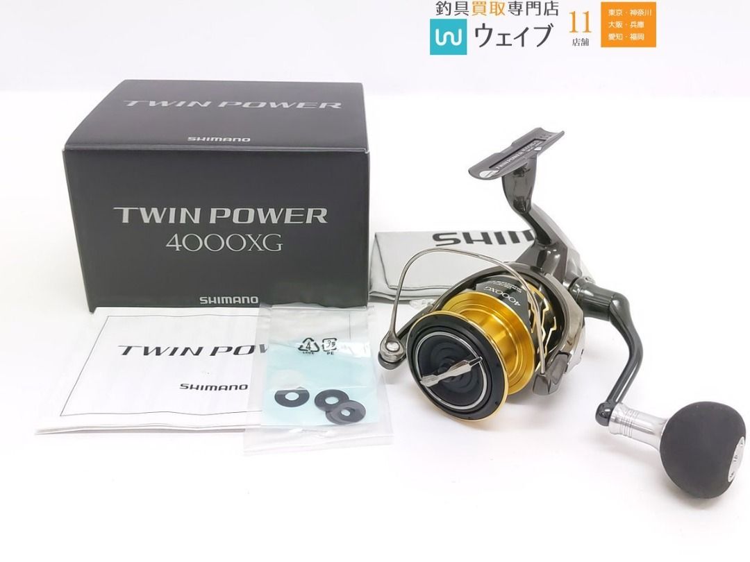 Shimano 20 Twin Power 4000XG (Category: Fishing) located in Caloocan City. Submitted by letao_shopping_ph (Listing ID 1470955931, Image 3). Description: There are signs of wear and minor scratches from use. There are scuffs/scratches on the spool edge. There is no noticeable roughness or grinding sensation during operation. The item has been tested and is in working order. The line roller is not seized. The handle can be swapped for left- or righ