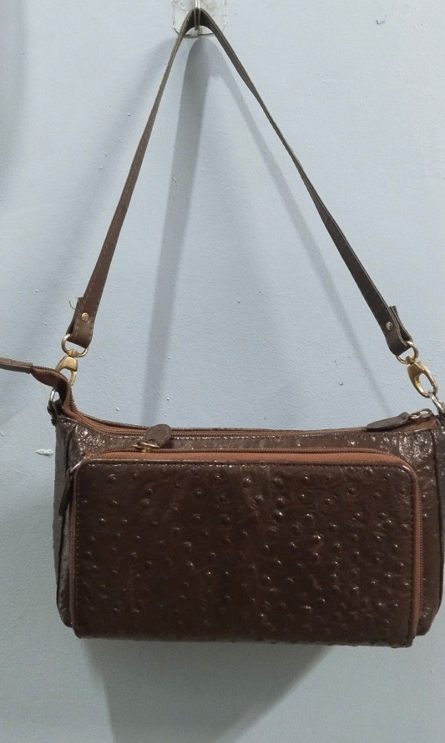Shoulder bag with card slot (Category: Shoulder Bags) located in Trece Martires City. Submitted by vherma (Listing ID 1470946074, Image 1). Description: brown ostrich-textured leather shoulder bag with a front zip pocket, gold-toned hardware, and a detachable or adjustable shoulder strap..