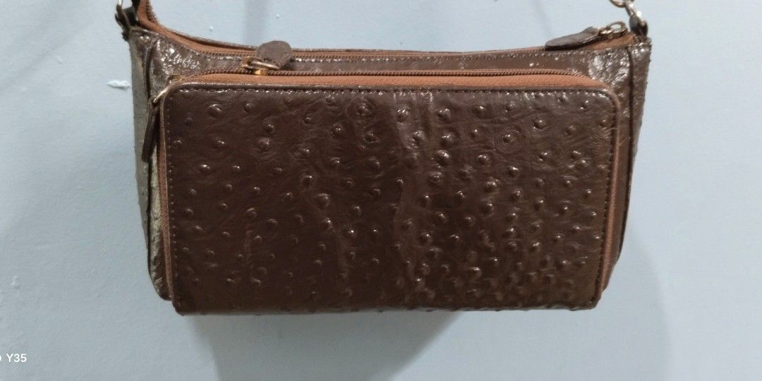 Shoulder bag with card slot (Category: Shoulder Bags) located in Trece Martires City. Submitted by vherma (Listing ID 1470946074, Image 2). Description: brown ostrich-textured leather shoulder bag with a front zip pocket, gold-toned hardware, and a detachable or adjustable shoulder strap..
