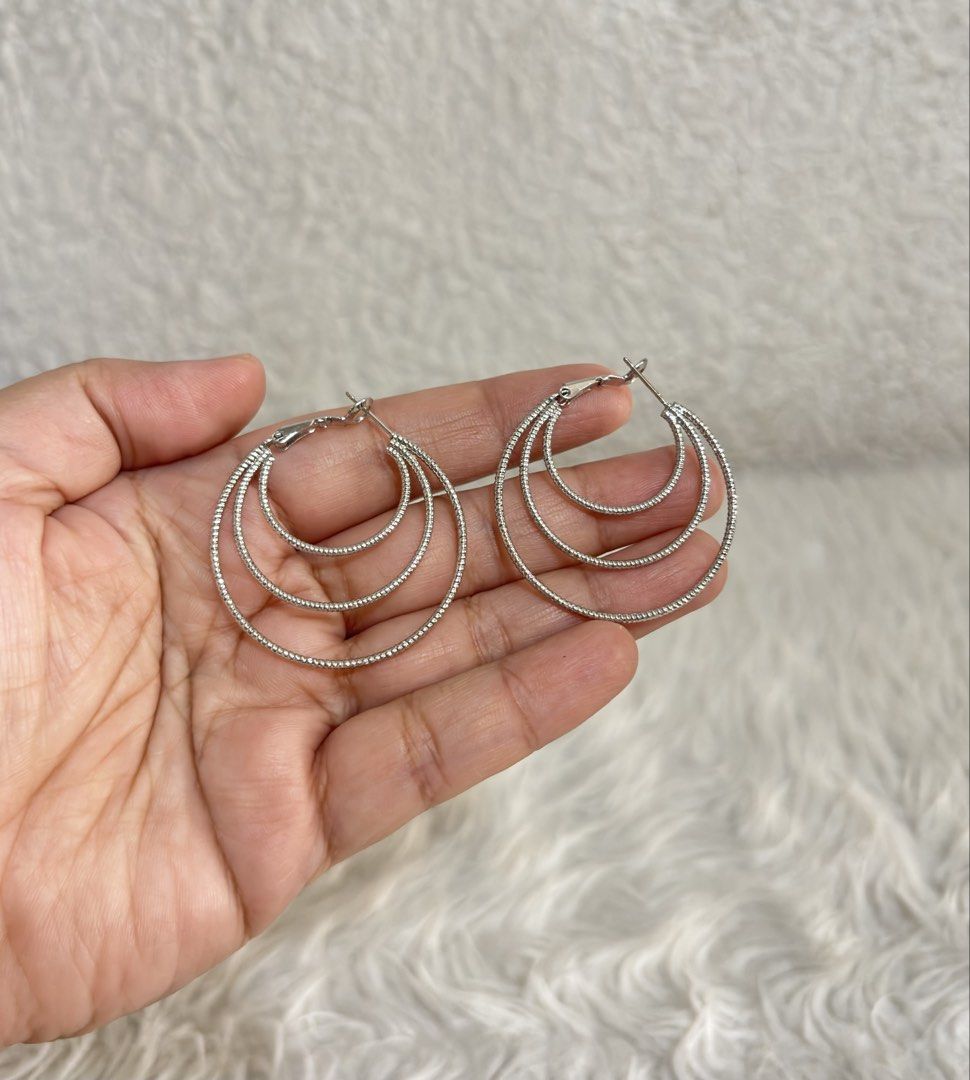 Silver-toned multi-hoop earrings (Category: Earrings) located in Paranaque City. Submitted by dalle_closet (Listing ID 1470990403, Image 1). Description: .