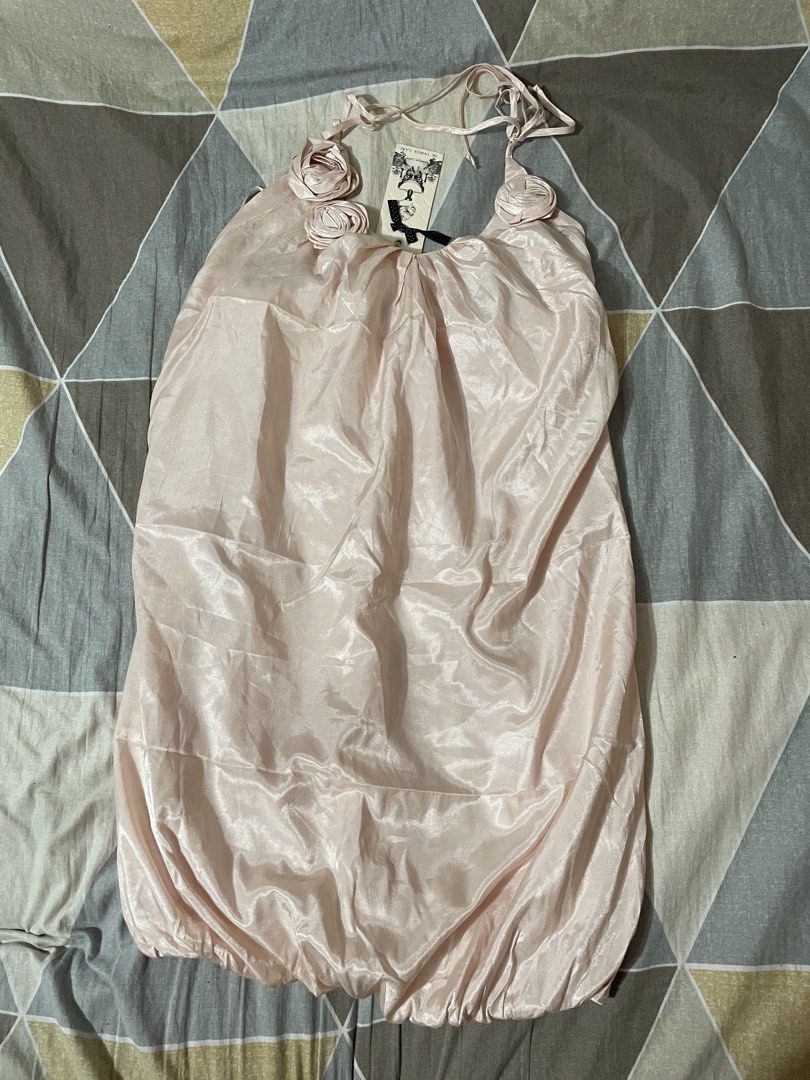 Dress Vietnam style (Category: Dresses) located in Taytay. Submitted by roxanne_03 (Listing ID 1470350399, Image 2). Description: super pretty when worn - Brand: Silvian Heach - Condition: Brand new with original tags attached - Size: XL - Color: Pastel Pink - Material: Smooth satin fabric with a subtle sheen - Design: Halter neck tie-up, adorable rosette details on the neckline, and a playful gathered bubble hem super pretty when worn and in per