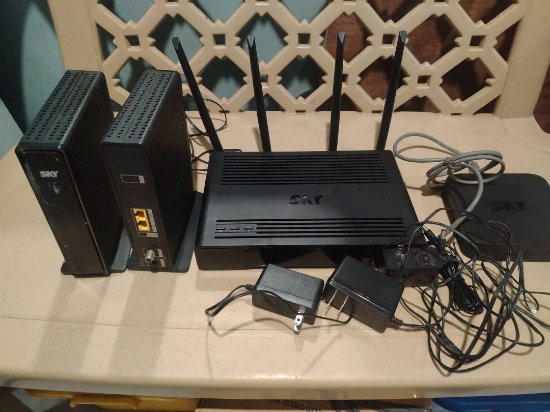 SKY & PLDT Home Wi-Fi Modems and Routers Bundle (Category: Networking) located in Manila. Submitted by elizer_tiger (Listing ID 1471050313, Image 3). Description: - Bundle of pre-loved internet networking gear from previous subscriptions - Includes multiple SKY black routers with antennas and power adapters - Includes vertical modems - Includes a PLDT Home DSL white modem unit in its original box with complete cables - All units tested and confir