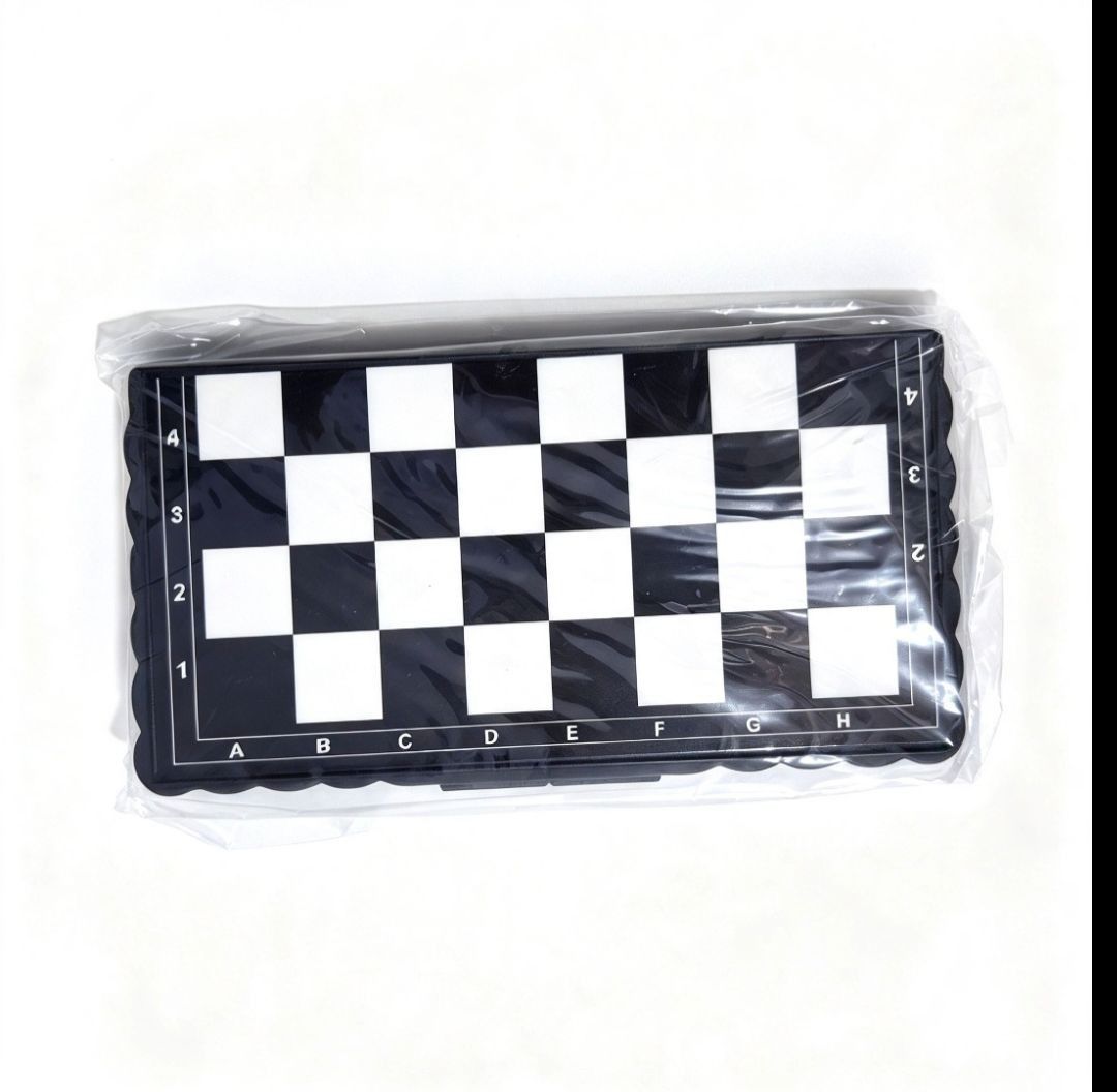 Small Chess Set Board Game (Category: Board Games & Puzzles) located in Quezon City. Submitted by ana-chan (Listing ID 1471047568, Image 1). Description: - Brand new, still in plastic packaging - Compact pocket-size design for easy travel and outdoor play - Classic black and white aesthetic - Features edge grid coordinates (A to H, 1 to 4) for convenient game notation.