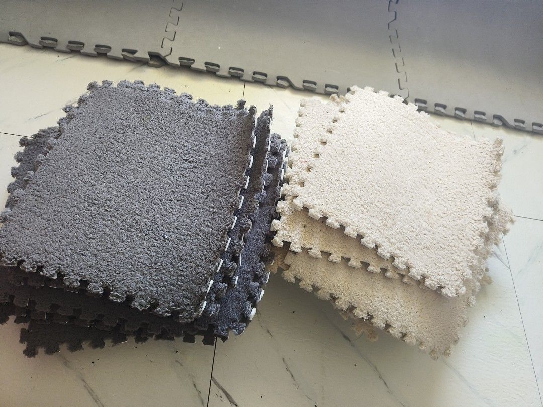 Soft Plush Interlocking Floor Mat 30x30cm Grey White (Category: Carpets, Mats & Flooring) located in Manila. Submitted by jewfindshop (Listing ID 1470991221, Image 2). Description: - Color: Dark grey and cream - Size: 30 x 30 cm per tile (40pcs set) - Texture: Soft, fuzzy, and cozy underfoot - Ideal for: Playrooms, bedrooms, or living spaces - Features: Easy to snap together, rearrange, and stack for storage.
