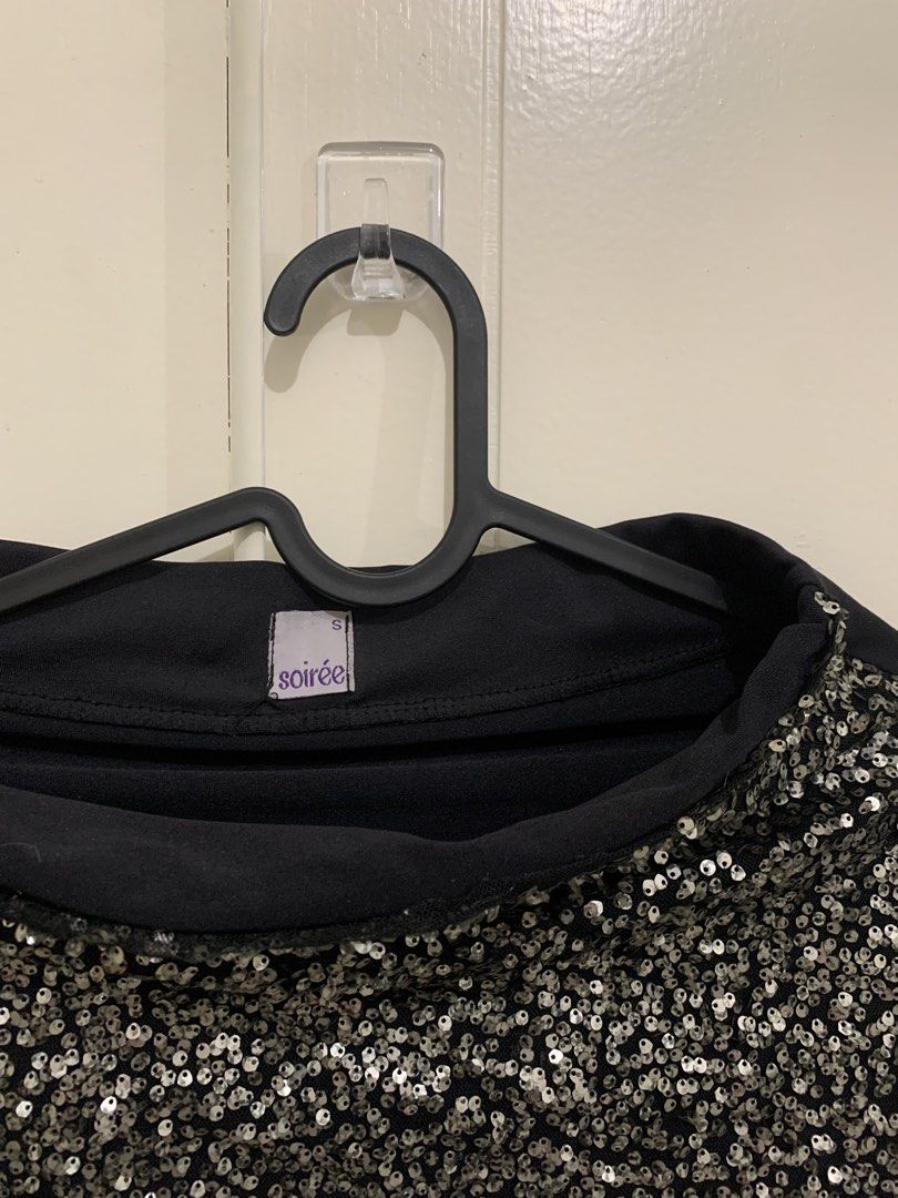 Soirée Sequin Mini Skirt Black Silver Size S (Category: Skirts) located in Pasig City. Submitted by lovedbyri (Listing ID 1471010277, Image 2). Description: - Brand: Soirée - Size: S - Design: Silver sequins on the front, plain black on the back - Style: Short mini skirt, perfect for parties and nights out - Material: Stretchy fabric, super easy to slip on - Condition: Brand new with tag attached.