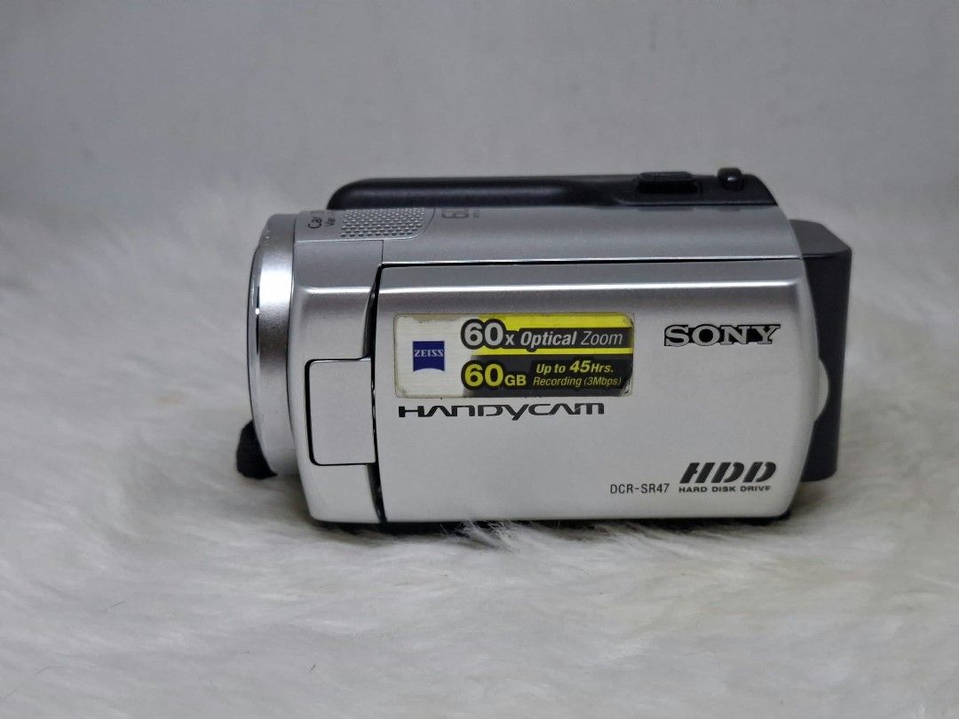 sony dcr - sr47 hard drive camcorder (Category: Video Cameras) located in Manila. Submitted by ultimogizmos (Listing ID 1470946142, Image 3). Description: sony dcr - sr47 Key Specifications Storage: 60GB internal hard disk drive plus a Memory Stick Duo slot for expanded media. [1] Video & Sensor: MPEG-2 SD codec (720x480 resolution) powered by a 1/8-inch CCD image sensor. [1, 2] Lens & Zoom: Carl Zeiss Vario-Tessar lens with 60x optical zoom and 