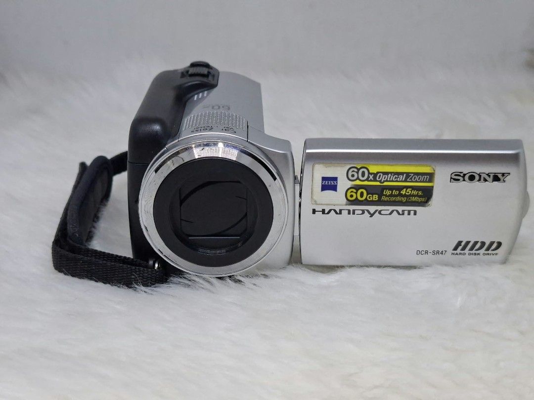 sony dcr - sr47 hard drive camcorder (Category: Video Cameras) located in Manila. Submitted by ultimogizmos (Listing ID 1470946142, Image 2). Description: sony dcr - sr47 Key Specifications Storage: 60GB internal hard disk drive plus a Memory Stick Duo slot for expanded media. [1] Video & Sensor: MPEG-2 SD codec (720x480 resolution) powered by a 1/8-inch CCD image sensor. [1, 2] Lens & Zoom: Carl Zeiss Vario-Tessar lens with 60x optical zoom and 