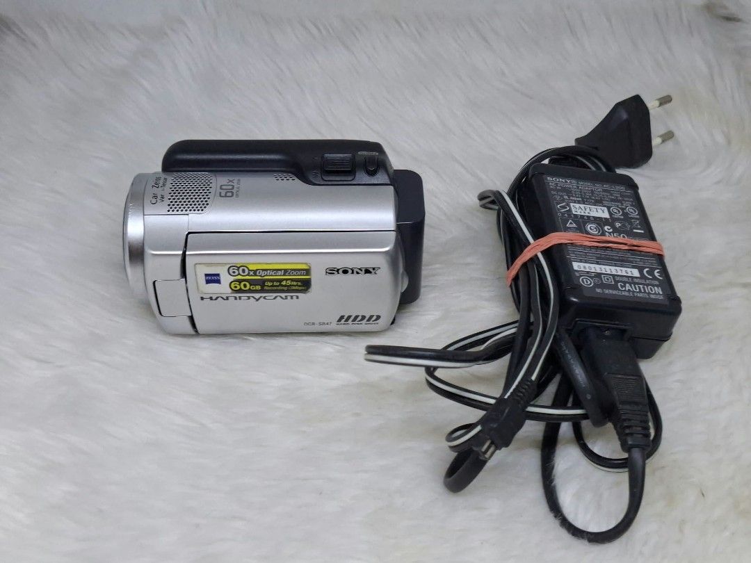 sony dcr - sr47 hard drive camcorder (Category: Video Cameras) located in Manila. Submitted by ultimogizmos (Listing ID 1470946142, Image 1). Description: sony dcr - sr47 Key Specifications Storage: 60GB internal hard disk drive plus a Memory Stick Duo slot for expanded media. [1] Video & Sensor: MPEG-2 SD codec (720x480 resolution) powered by a 1/8-inch CCD image sensor. [1, 2] Lens & Zoom: Carl Zeiss Vario-Tessar lens with 60x optical zoom and 