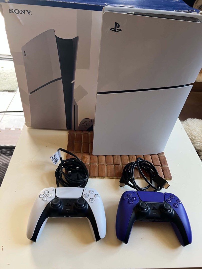 Sony PlayStation 5 Console with 2 Controllers and Games (Category: PlayStation) located in Manila. Submitted by cjm00 (Listing ID 1470954340, Image 2). Description: - Sony PlayStation 5 console with original box - 2 DualSense controllers (White and Purple) - Power and HDMI cables included - 4 Physical games: Split Fiction, Call of Duty Black Ops Cold War, Tom Clancy's The Division 2, and Metal Gear Survive - Plug and play, everything pictured is 
