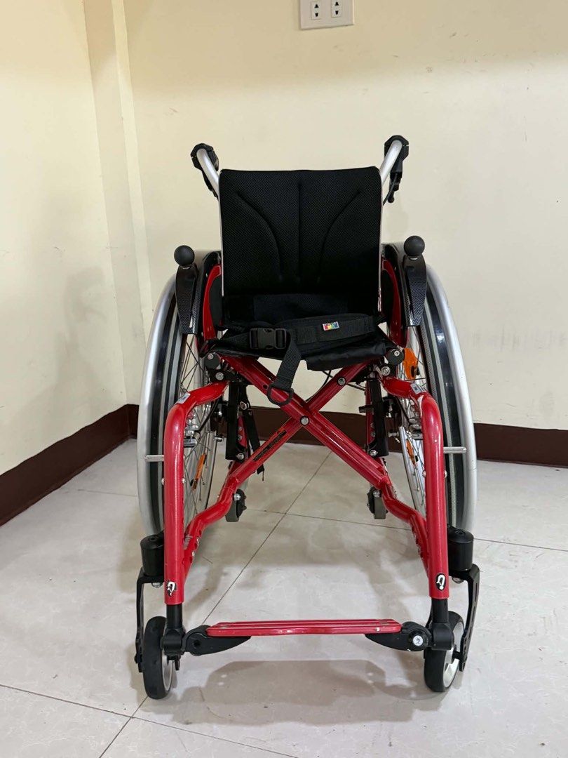 SORG Red Pediatric Wheelchair Mobility Aid (Category: Wheelchairs) located in Manila. Submitted by calmdolphin.87b0e4 (Listing ID 1470960135, Image 1). Description: - Brand: SORG pediatric wheelchair in eye-catching bright red - Mobility & Safety: Sturdy metal frame, smooth-swiveling front casters, and reliable attendant brakes - Wheels: Large spoked wheels with high-quality Schwalbe RightRun tires and orange reflectors - Comfort & Storage: Breat