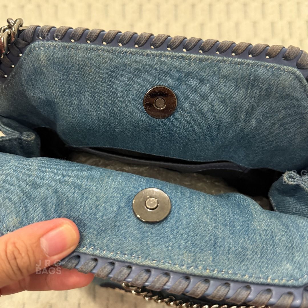 Stella McCartney Denim Patchwork Falabella Bag (Category: Tote Bags) located in Paranaque City. Submitted by juliasmomsy (Listing ID 1471060581, Image 3). Description: Selling my pre-loved bags! :) - Authentic Stella McCartney Eco Denim Embroidered Zigarette Falabella Fold Over Tote - SIZE: L: 26 cm, H: 29 cm, W: 9 cm - COLOR AND MATERIAL: Denim - HARDWARE: Silver ruthenium chain trim and branded circular charm. - CHAIN STRAP: Short (Drop L: 11 c