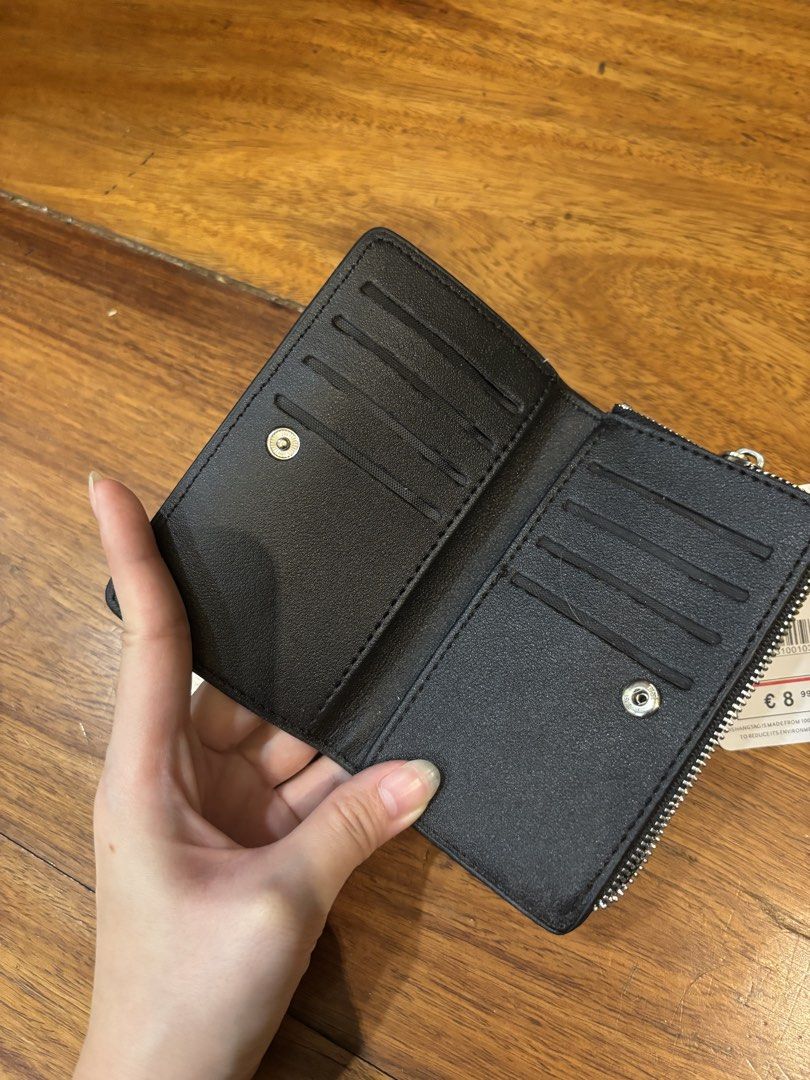 Stradivarius Black Croc Embossed Wallet (Category: Wallets & Card holders) located in Manila. Submitted by zephaniah79 (Listing ID 1471027699, Image 2). Description: - Brand new with tags attached (retail price on tag) - Chic black color with a glossy croc-embossed texture - Secure snap button closure - Features a zip compartment and multiple card slots - Compact and lightweight, fits easily in small bags.
