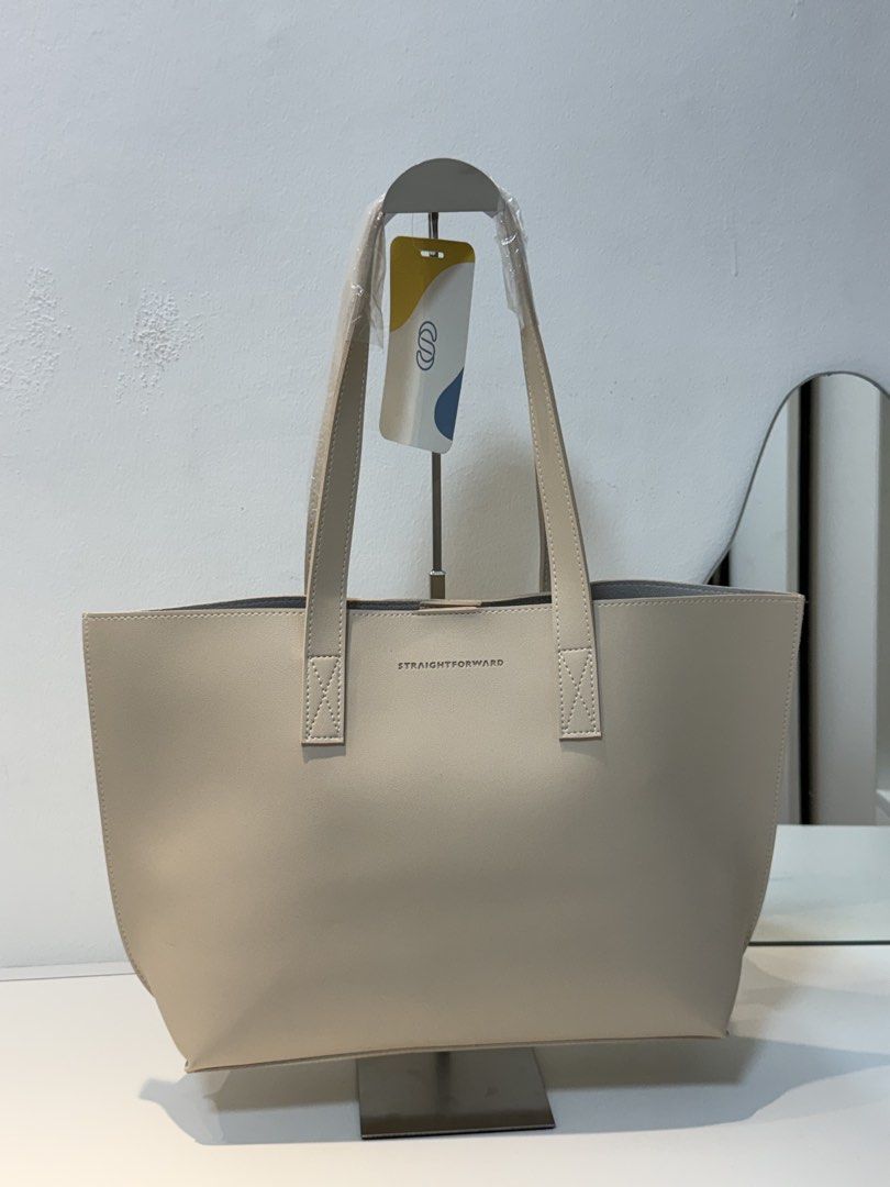 Straightforward Boundless Basics Tote Bag (Category: Tote Bags) located in Marikina City. Submitted by ms.ces (Listing ID 1471005158, Image 1). Description: - Brand: Straightforward - Color: Sand (Neutral shade) - Condition: Brand new with tag still attached - Design: Clean, minimal aesthetic with dual shoulder straps - Durability: Reinforced stitching at the base of handles - Capacity: Roomy interior, ideal for daily commute, work, or school ess