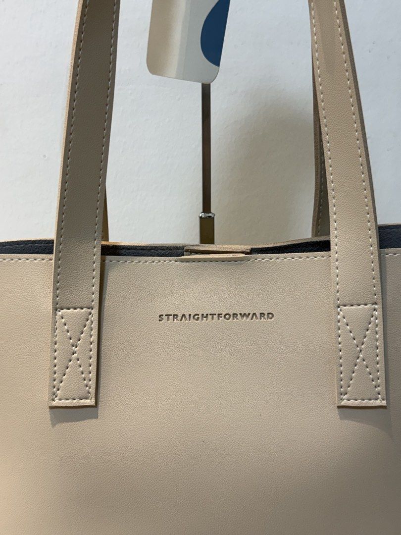 Straightforward Boundless Basics Tote Bag (Category: Tote Bags) located in Marikina City. Submitted by ms.ces (Listing ID 1471005158, Image 2). Description: - Brand: Straightforward - Color: Sand (Neutral shade) - Condition: Brand new with tag still attached - Design: Clean, minimal aesthetic with dual shoulder straps - Durability: Reinforced stitching at the base of handles - Capacity: Roomy interior, ideal for daily commute, work, or school ess