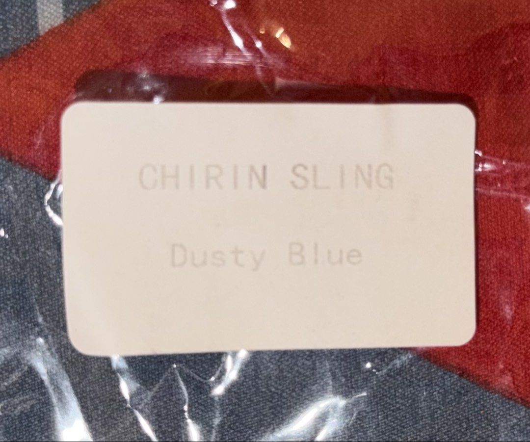 Straightforward Chirin Sling Bag in Dusty Blue (Category: Cross-body Bags) located in Manila. Submitted by nayeoniescart (Listing ID 1471094147, Image 3). Description: - Brand: Straightforward Chirin (BOUGHT AT SM SAN LAZARO) - Color: Dusty Blue - Material: Soft pleated nylon fabric - Closure: Zip top closure - Design: Structured base, adjustable strap clips on both sides, and centered square branded logo patch - Inclusions: Original dust bag and