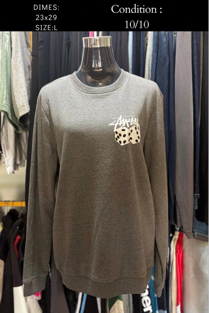 Stussy Grey Dice Crewneck Sweatshirt Size L (Category: Coats, Jackets and Outerwear) located in Brookes Point. Submitted by grandfish.2f86fc (Listing ID 1470969421, Image 1). Description: - Brand: Stussy - Style: Crewneck sweatshirt - Color: Grey heather - Design: White dice graphic on left chest with classic branding - Size: Tagged L - Measurements: 23" pit to pit, 29" length - Condition: Gently worn, clean piece.