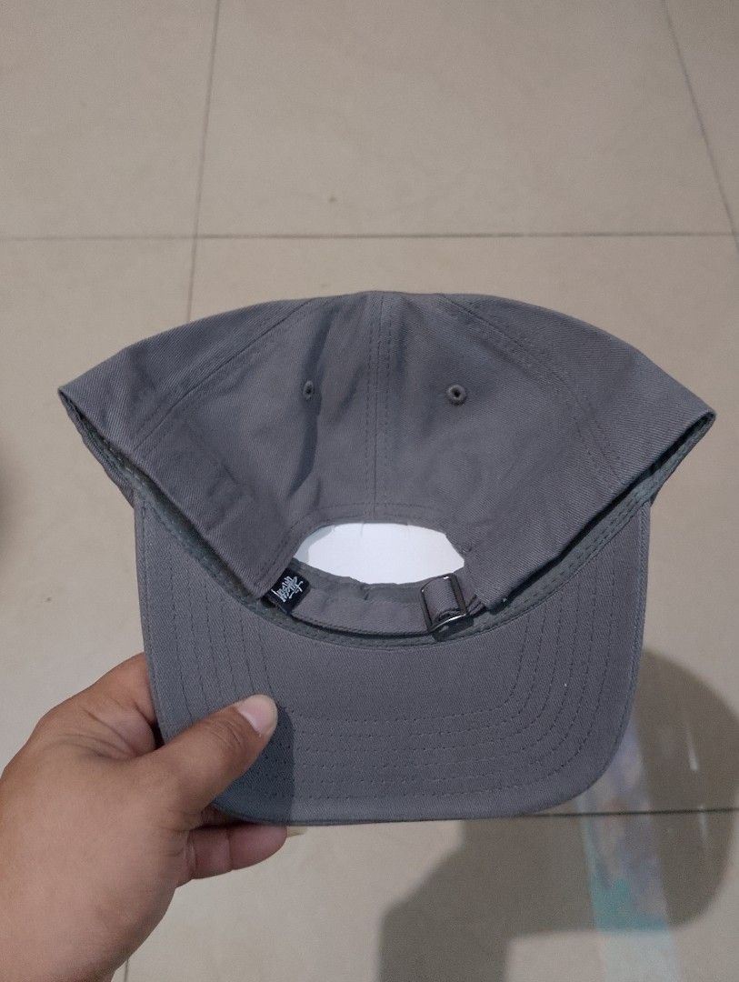 Stussy Stock Logo Strapback Cap Grey (Category: Caps & Hats) located in Manila. Submitted by thriftyboyzzz (Listing ID 1470998286, Image 2). Description: - Brand: Stussy - Style: Stock logo cap - Color: Charcoal grey with white embroidery - Material: 100% cotton, made in Bangladesh - Closure: Adjustable metal buckle with Stussy woven tag - Condition: Brand new with tags (BNWT).