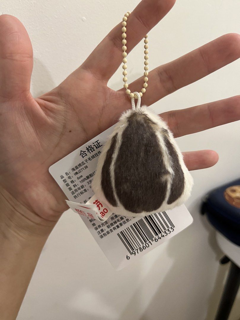 Sunflower Seed Plush Keychain (Category: Plushies & Soft Toys) located in Quezon City. Submitted by saleinqc (Listing ID 1471055508, Image 2). Description: - Authentic Haidilao merchandise - Adorable tiny rabbit design with winking eyes and red heart mouth - Soft and fuzzy material, measures approx. 6cm - Comes with a silver ball chain for easy hanging on bags, pouches, or keys - Brand new with original red tag and white barcode tag intact - Clea