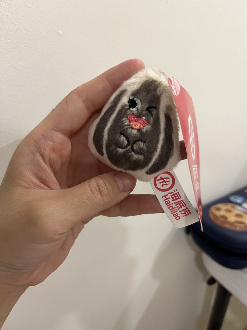 Sunflower Seed Plush Keychain (Category: Plushies & Soft Toys) located in Quezon City. Submitted by saleinqc (Listing ID 1471055508, Image 1). Description: - Authentic Haidilao merchandise - Adorable tiny rabbit design with winking eyes and red heart mouth - Soft and fuzzy material, measures approx. 6cm - Comes with a silver ball chain for easy hanging on bags, pouches, or keys - Brand new with original red tag and white barcode tag intact - Clea