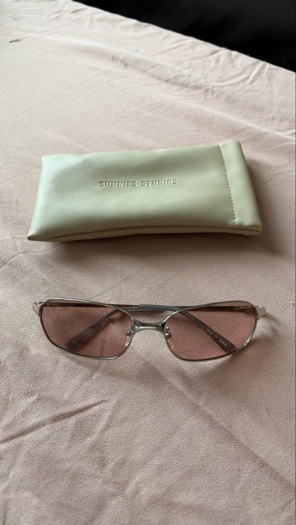 Sunnies Studios Aspen Silver Lychee Sunglasses (Category: Sunglasses & Eyewear) located in Mandaluyong City. Submitted by andreyamari_ (Listing ID 1470944448, Image 1). Description: - Brand: Sunnies Studios - Model: Aspen - Frame: Silver rectangular metal frame (Y2K aesthetic) - Lenses: Lychee pink tinted, clean condition - Condition: Barely worn, like new .