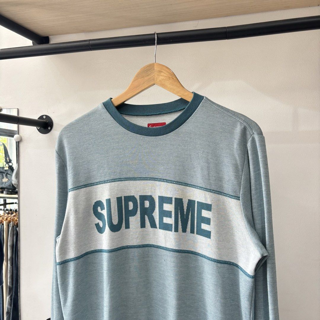 Supreme Panel Striped Long Sleeve Crewneck (Category: Coats, Jackets and Outerwear) located in Bambang. Submitted by heats777 (Listing ID 1471039459, Image 1). Description: - Brand: Supreme - Style: Crewneck sweater with large chest logo - Colorway: Light blue and dark teal - Size: Medium (includes red box logo neck tag) - Material: Cotton-polyester blend - Origin: Made in China - Condition: Excellent, carefully stored - Shipping: Fast ship natio