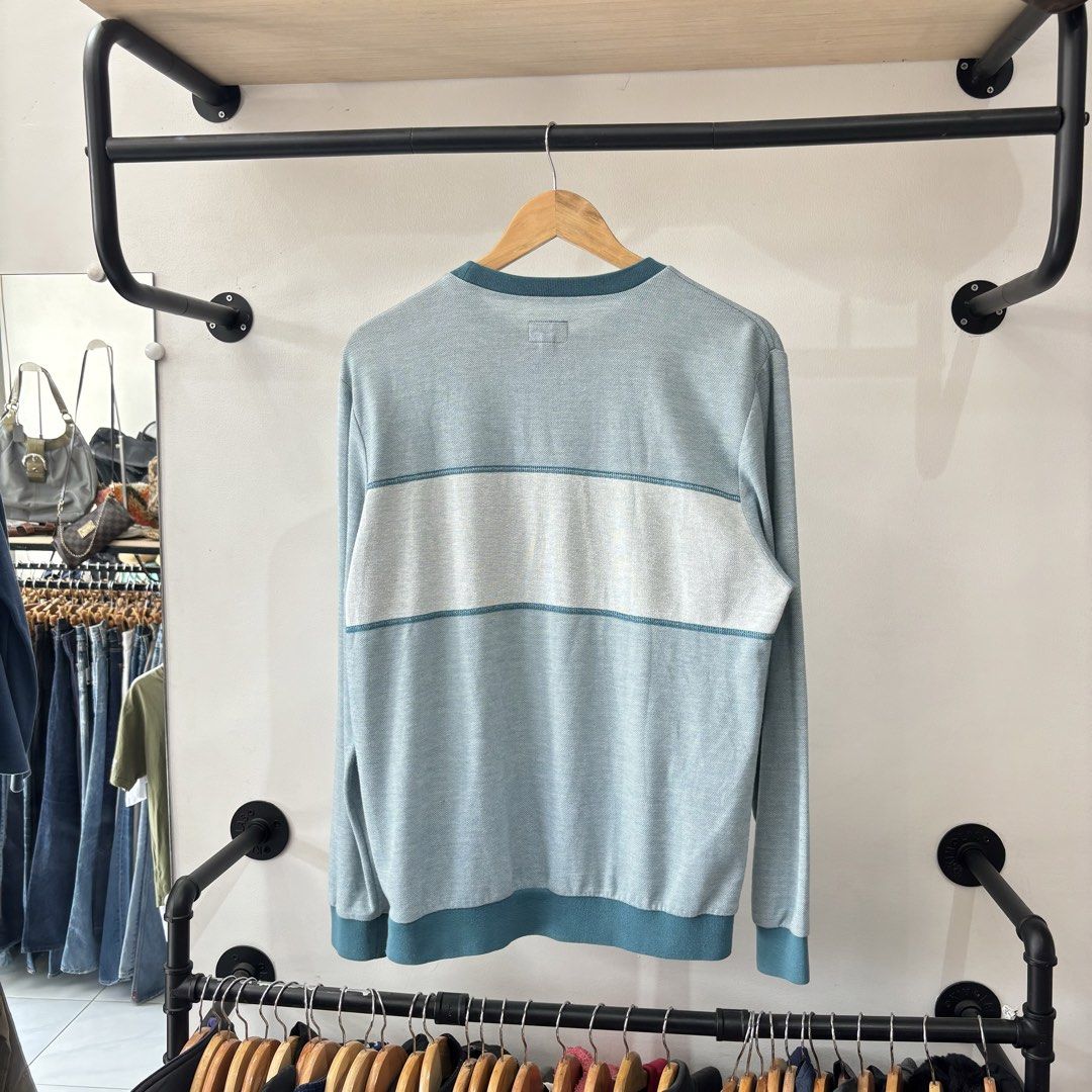 Supreme Panel Striped Long Sleeve Crewneck (Category: Coats, Jackets and Outerwear) located in Bambang. Submitted by heats777 (Listing ID 1471039459, Image 3). Description: - Brand: Supreme - Style: Crewneck sweater with large chest logo - Colorway: Light blue and dark teal - Size: Medium (includes red box logo neck tag) - Material: Cotton-polyester blend - Origin: Made in China - Condition: Excellent, carefully stored - Shipping: Fast ship natio
