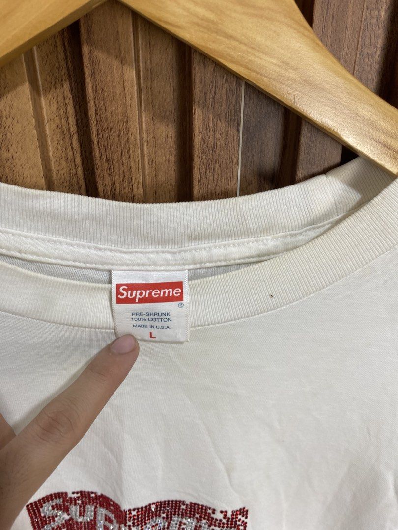 Supreme Rhinestone Box Logo White Tee (Category: Shirts) located in Caloocan City. Submitted by heatedcaps4425 (Listing ID 1471098831, Image 3). Description: - Brand: Supreme - Item: Rhinestone Box Logo T-Shirt - Color: White - Size: Large - Material: 100% pre-shrunk cotton, Made in USA - Condition: Pre-owned with noticeable yellowish stains on the lower front area and near the collar - Style: Classic streetwear piece.