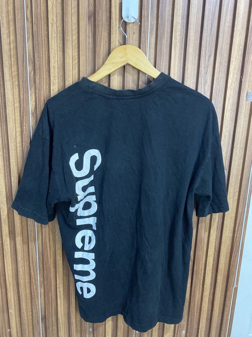 Supreme vertical logo black t-shirt (Category: Tshirts & Polo Shirts ) located in Caloocan City. Submitted by heatedcaps4425 (Listing ID 1471098659, Image 2). Description: - Color: Black - Fit: Relaxed fit with classic crew neckline - Design: Bold vertical Supreme branding on front left - Detail: Iconic red Supreme box logo on lower left hem - Material: Cotton with normal signs of wear - Styling: Great for pairing with jeans or sweatpants.