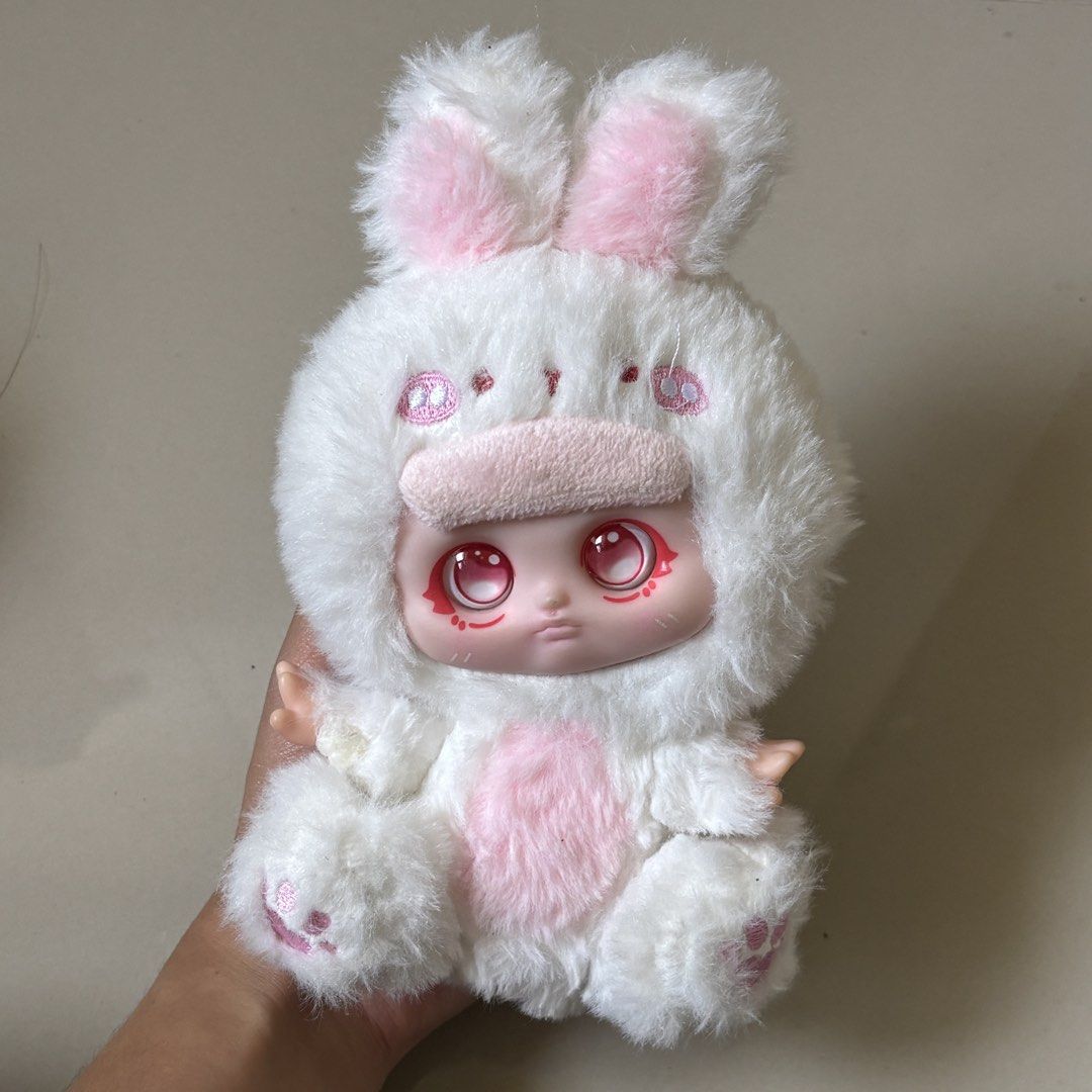 take all 150 (Category: Designer & Blind Box Toys) located in Manila. Submitted by lavieelle (Listing ID 1470955040, Image 2). Description: - nooki zoo party little rabbit and collectible bonana green dinosaur hoodie plushie with button eyes and a soft-vinyl face - fluffy white & pink plushie from blind box - toy city: Mr. Pa - Animal Co plush blind box - rfs: decluttering .